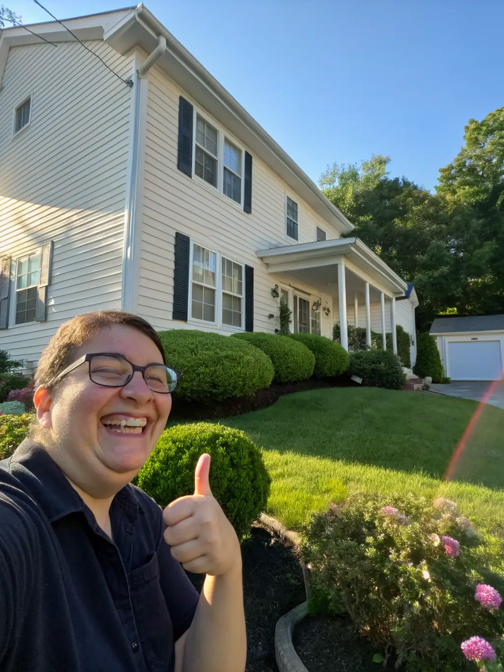 Pressure washing service cleaning a concrete driveway in Cincinnati OH by Brighter Day Exterior Cleaning